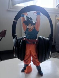 Bose Headphones resting on a DBZ Anime Figurine