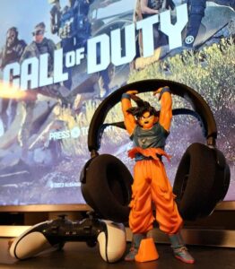 Review photo of A screen that say Call of Duty with a Goku headphone stand holding Sony Headphones